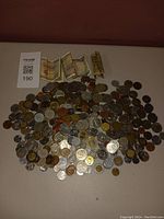 Overall spread of coins and paper bills displayed on a flat surface.