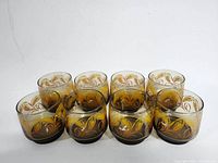 Front top angle view of 8 amber Libbey glasses showing Harvest Wheat etched design.
