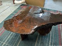 Overhead view showing irregular live-edge top and high-gloss finish