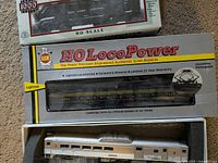 Four HO scale model locomotives in original boxes, showing brand new condition.