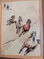 Close-up of the watercolor painting showing four horses in dynamic running posture with a soft textured background.