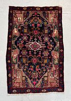 Full view of rug on floor showing overall pattern and colors