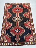 Full view of rug showing overall open field pattern and dimensions.