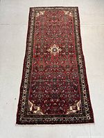 Full view of rug laid flat on floor showing overall pattern and color