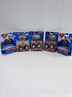 All six Hot Wheels vehicles displayed in original, sealed packaging, various themes including Superman and Monster Jam visible.