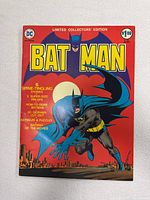 Front cover of Batman C-25 comic book with red background, Batman figure, and large yellow moon.