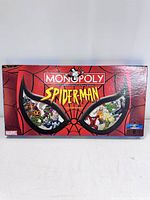 Front of Hasbro Spider-Man Monopoly Collector's Edition 2002 box with Spider-Man mask design and Marvel branding.