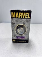 Front of original Marvel box packaging showing product window with watch dial visible