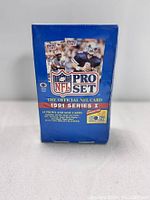 Front view of sealed 1991 NFL Pro Set Series 1 full box of football trading cards.