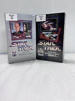 Front view of two sealed boxes of Star Trek Official Trading Cards Series 1 & 2 showing characters and ship images with price stickers $35 on each.