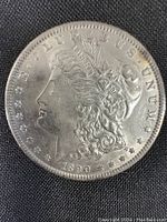 Obverse side of the 1890 US Morgan Silver Dollar showing Lady Liberty and date.