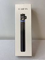 Front side of the Kaiess tripod box, showing the tripod in collapsed form inside the packaging.