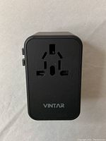 Front view showing multi-plug socket and VINTAR branding.