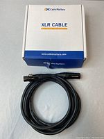 Cable Matters branded box with XLR cable coiled in front.