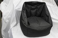 Photo of the black bean bag chair showing its structured bucket-style shape.
