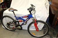 Side view of CCM Revenge mountain bike showing full frame, tires, seat, and handlebar.