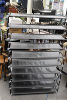 Front view of the multi-tier fabric storage rack showing its structure and size.