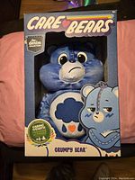 Front view of boxed Denim Collection Grumpy Bear plush in its original packaging.