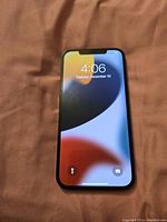 Front of iPhone displaying lock screen, showing screen functionality and front condition