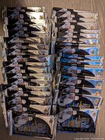 32 unopened hockey card packs laid out beside the open box.