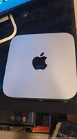 Top view of silver Apple Mac mini showing aluminum casing and Apple logo