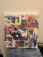 Closed box set featuring a colorful collage design with images of Elton John and text.