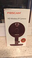Front of the Foscam HD Wireless IP Camera box showing model and image of camera.