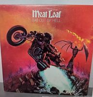 Front cover of Meat Loaf Bat Out Of Hell album showing the iconic motorcycle and demon figure artwork.