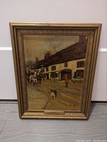 Framed oil painting showing a street scene in New England with a horse and carriage, dog, and people, signed by Wool Hampton