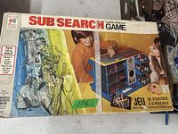 Photo of game box for Sub Search 3 Level Strategy Game by MB showing front illustration and age recommendation.