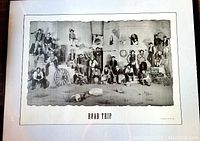 Overall view of the framed 'Road Trip' poster showing a group of people in period clothing in a black and white image with the text 'ROAD TRIP' centered below the artwork.