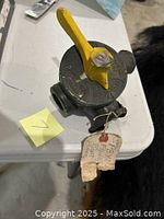 Fuel shut off valve with yellow lever and attached original tag identifying it as from WW2 PBY Flying Boat.