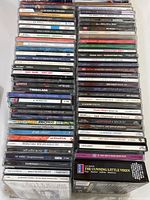 Top and side view of stacked vintage CDs spanning Jazz, Blues, R&B and more.