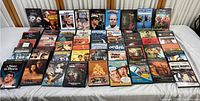 Front view of 40 DVD cases laid out on a table showing a collection of classic movies including The Exorcist, Guess Who's Coming to Dinner, and A Star Is Born