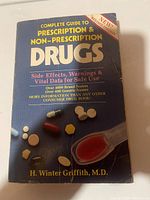 Front cover of the book Complete Guide to Prescription & Non-Prescription Drugs, showing pills and the book title.