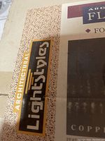 Close-up photo of the Architectural Styles logo on the box.
