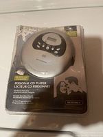 Magnavox personal CD player visible in unopened part of the original plastic packaging