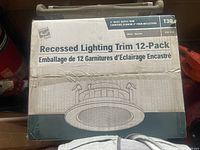 Box front view showing 'Recessed Lighting Trim 12-Pack,' white baffle trim, model T30, 4 inch, with product illustration.