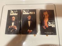 Front view of The Godfather Parts I, II, and III VHS box cases.