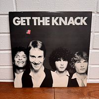 Front of the album cover showing four band members with title 'Get The Knack'