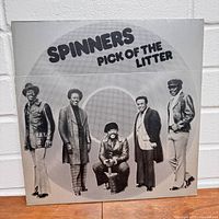 Front cover of the Spinners Pick of the Litter vinyl album showing the band members standing in a line with the album title above them.