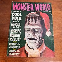 Front cover of the vintage 1965 Monster World magazine featuring a Frankenstein Monster in a Santa outfit and festive holiday horror text.