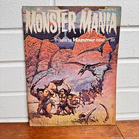 Front cover of the January 1967 issue No. 2 of Monster Mania magazine showing illustrated prehistoric scene and pterodactyl, text tribute to Hammer films.