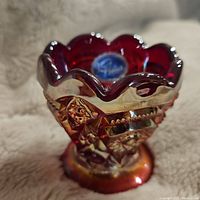 Front angle view of the toothpick holder with a clear label inside and visible geometric decoration.