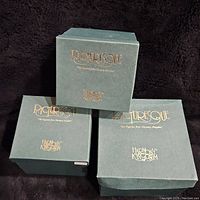 Three green boxes labeled Picturesque by Harmony Kingdom, shown stacked.