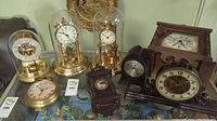 Group shot of eight clocks on table