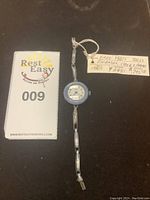 Full view of watch with lot tag and Rest Easy marker