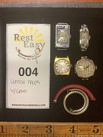 Overview of six items: two art deco gem-set watch faces, two gold-tone faces, two bands