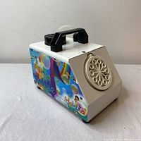 Front view of Hakuta Bubble Machine BP73 showing bubble outlet ring and handle on top. Machine resting on white cloth.