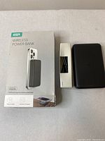 Photo showing ESR wireless power bank, box, and charging cable